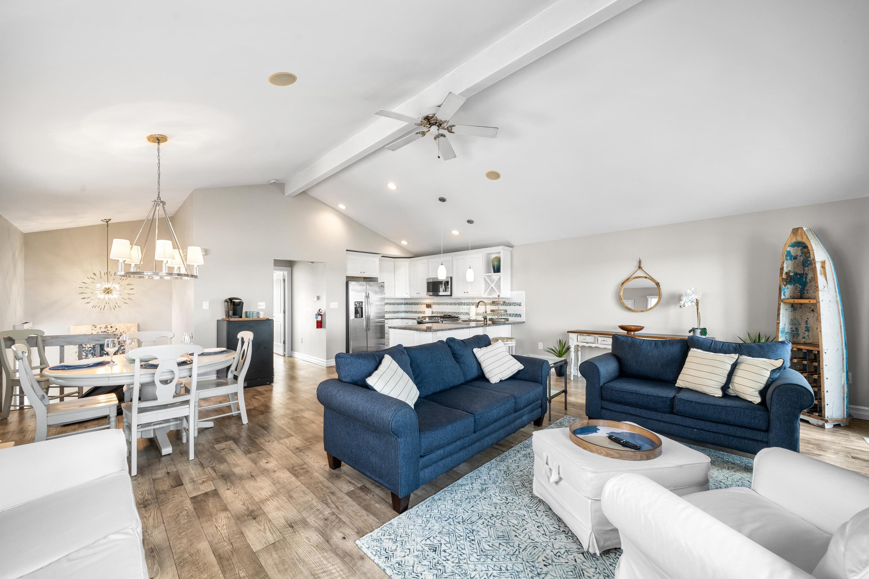 2934 Ocean Drive, Unit NORTH Avalon, NJ 08202 - Photo 6 of 33 a living room with furniture kitchen view and a chandelier