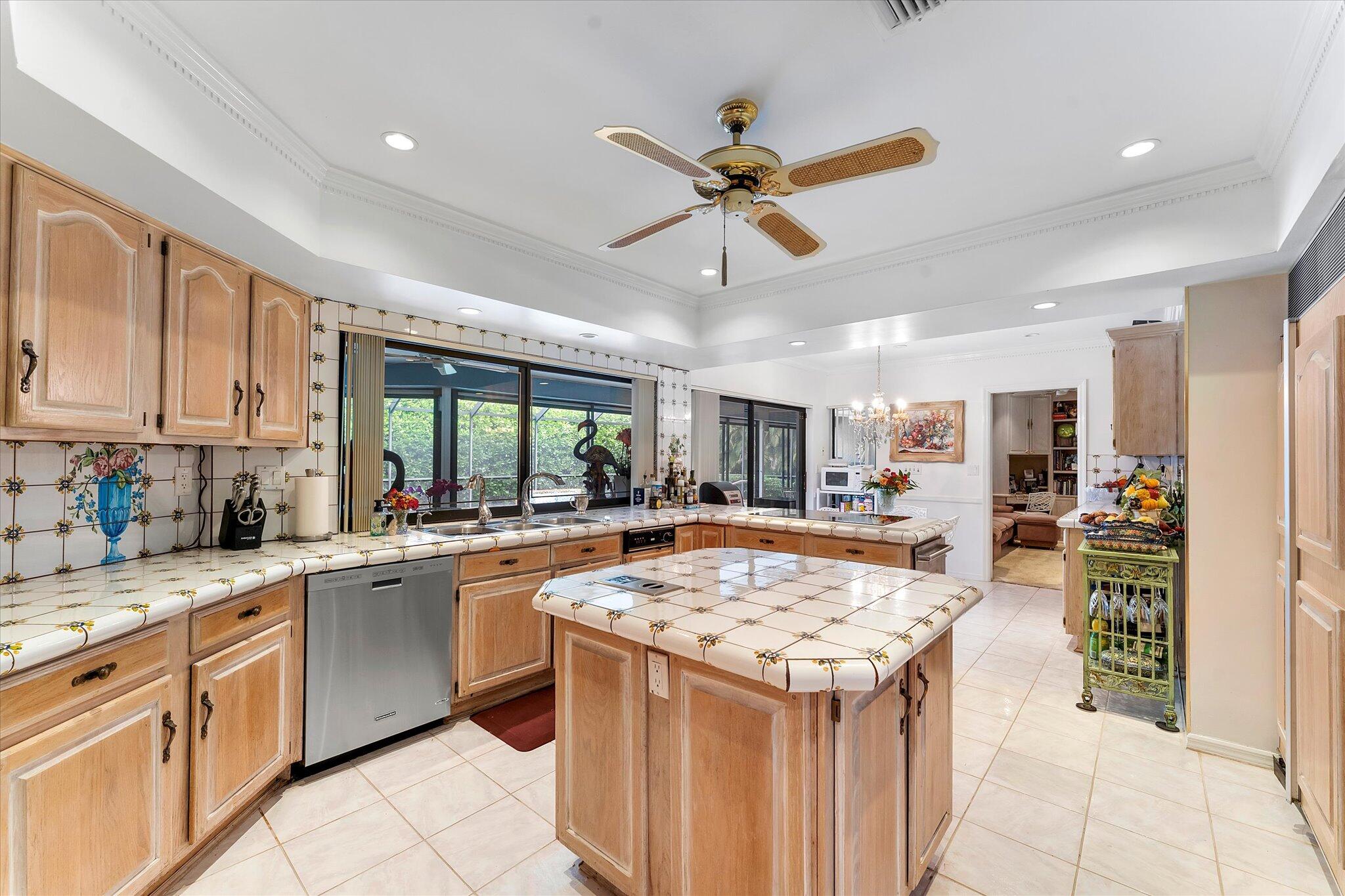 3333 Southwest 59th Street Fort Lauderdale, FL 33312 - Photo 20 of 56 a kitchen with a stove a sink dishwasher and a refrigerator with wooden floor