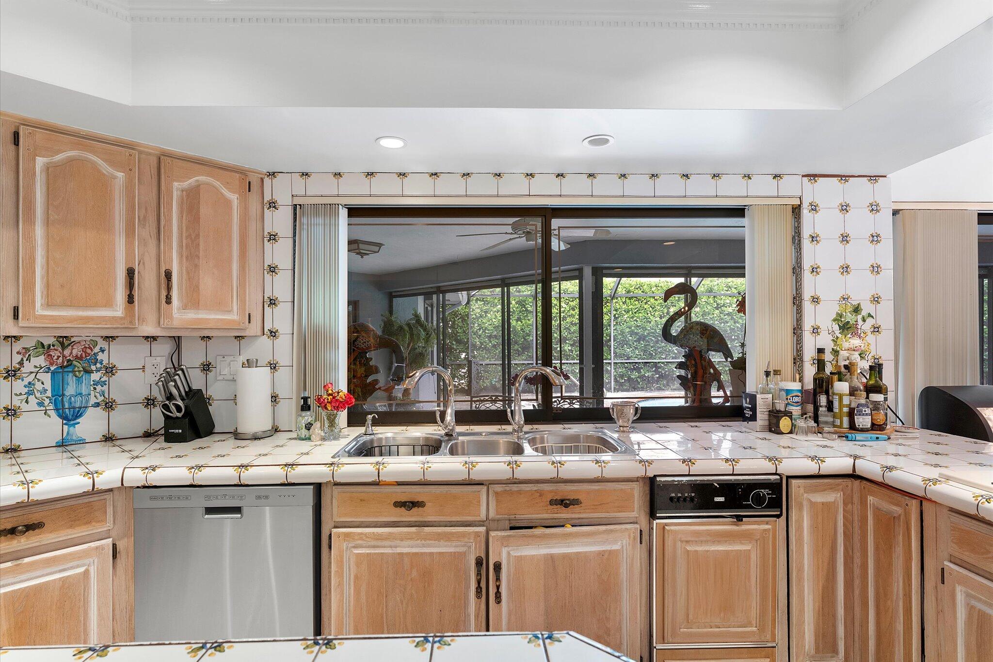 3333 Southwest 59th Street Fort Lauderdale, FL 33312 - Photo 21 of 56 a kitchen with granite countertop a sink and a white wooden cabinets