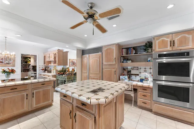 a kitchen with stainless steel appliances granite countertop a sink and cabinets