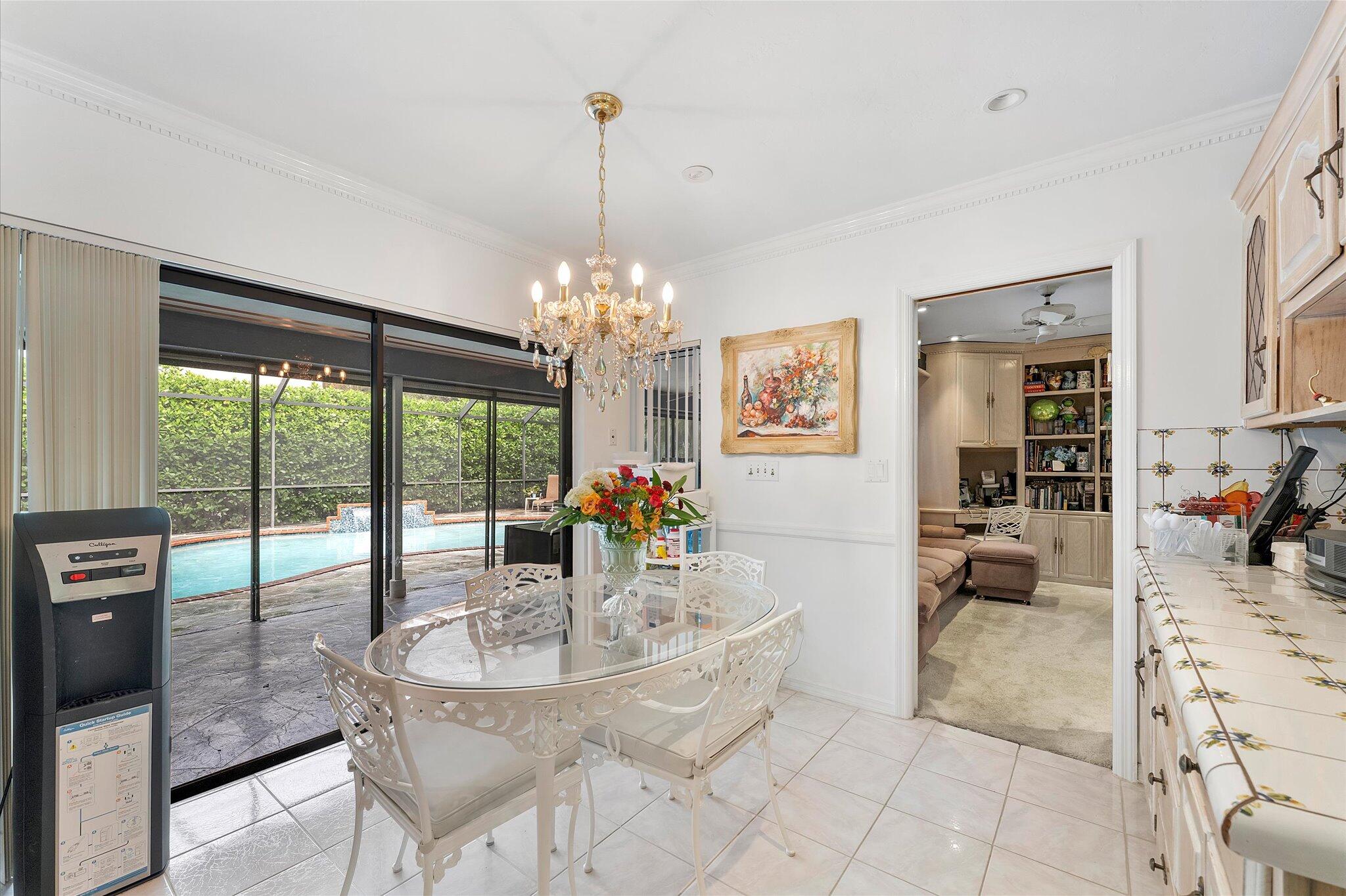 3333 Southwest 59th Street Fort Lauderdale, FL 33312 - Photo 26 of 56 a dining room with furniture a chandelier and wooden floor