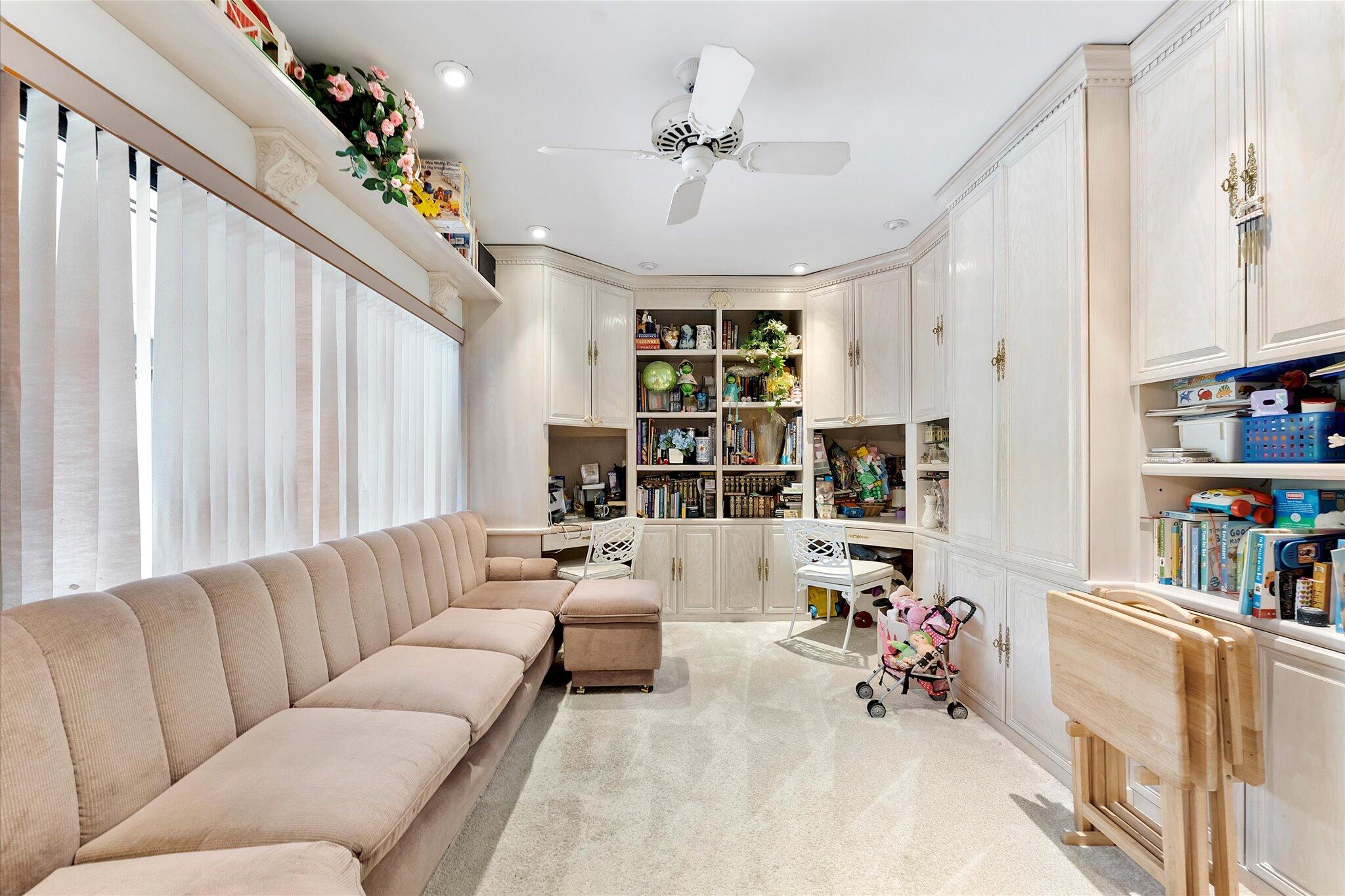 3333 Southwest 59th Street Fort Lauderdale, FL 33312 - Photo 27 of 56 a living room with furniture and a book shelf