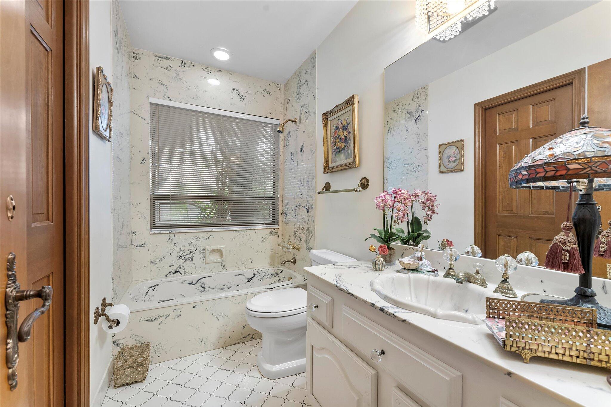 3333 Southwest 59th Street Fort Lauderdale, FL 33312 - Photo 28 of 56 a bathroom with a granite countertop sink mirror and a bathtub