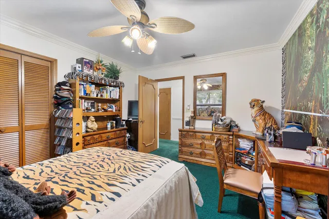 a bedroom with a bed and a dresser