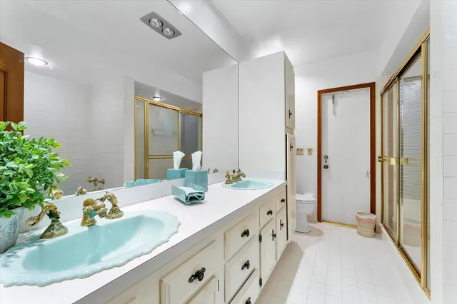 a bathroom with a bathtub and shower