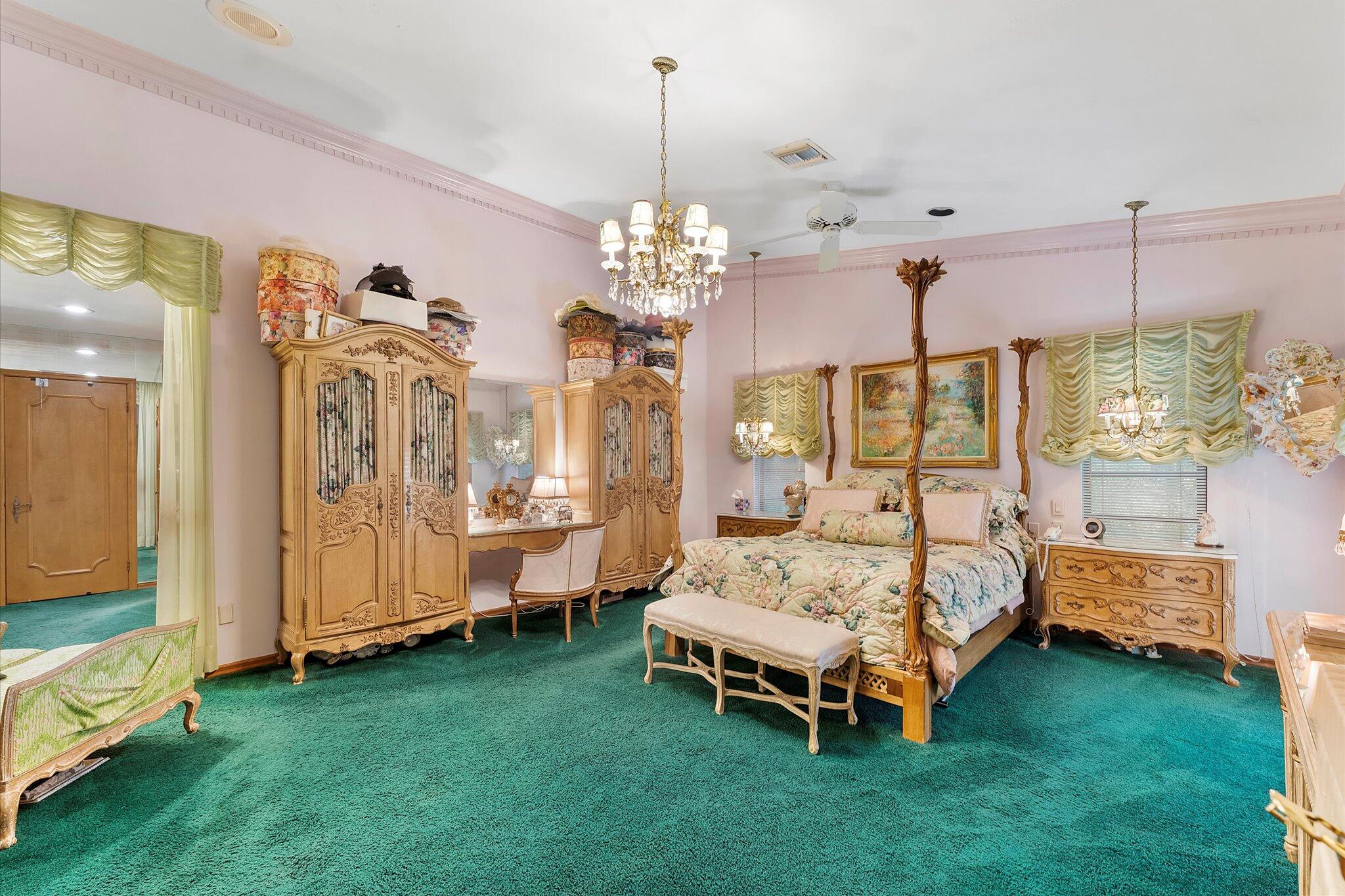 3333 Southwest 59th Street Fort Lauderdale, FL 33312 - Photo 38 of 56 a spacious bedroom with bed and a chandelier