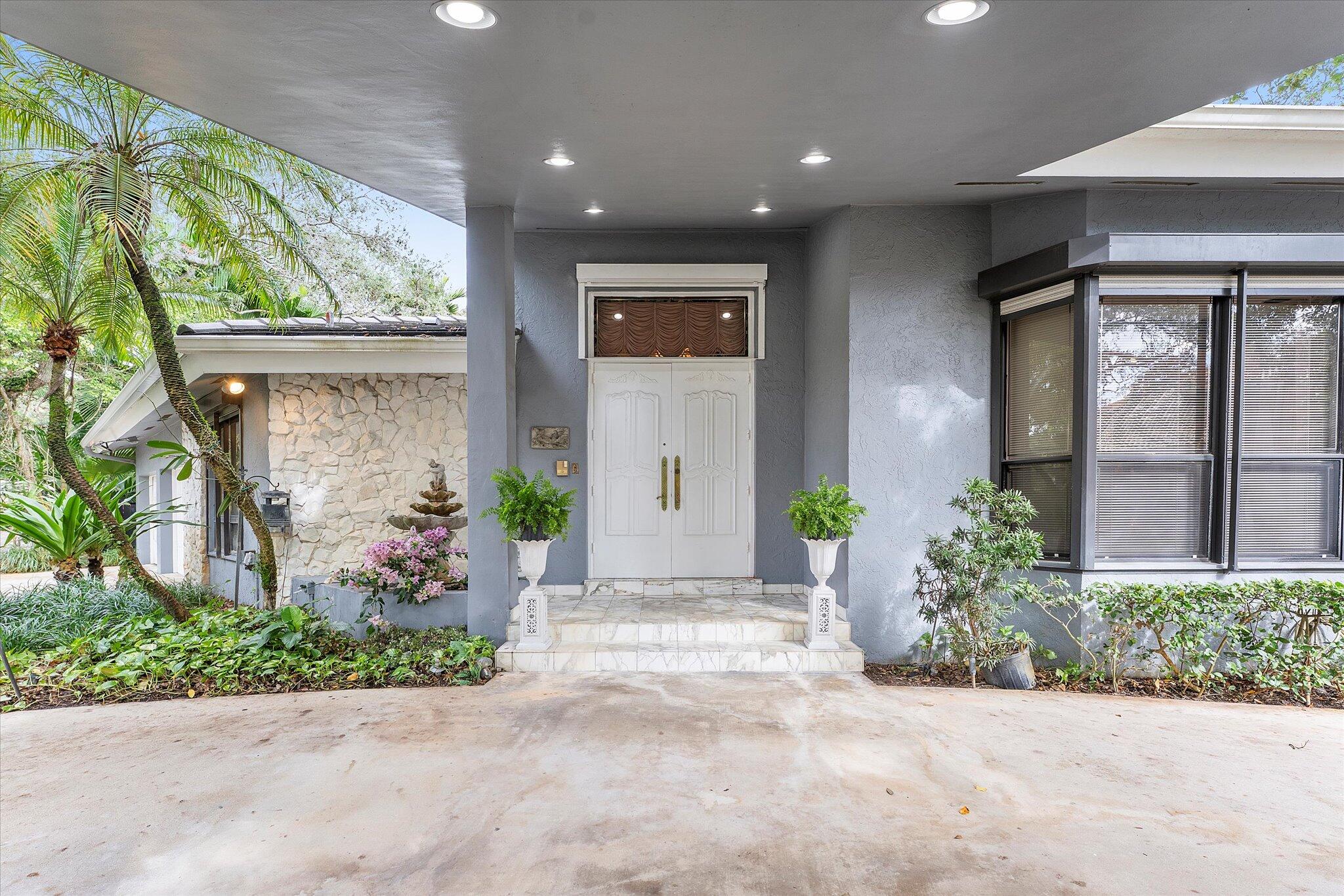 3333 Southwest 59th Street Fort Lauderdale, FL 33312 - Photo 4 of 56 a front view of a house with a yard