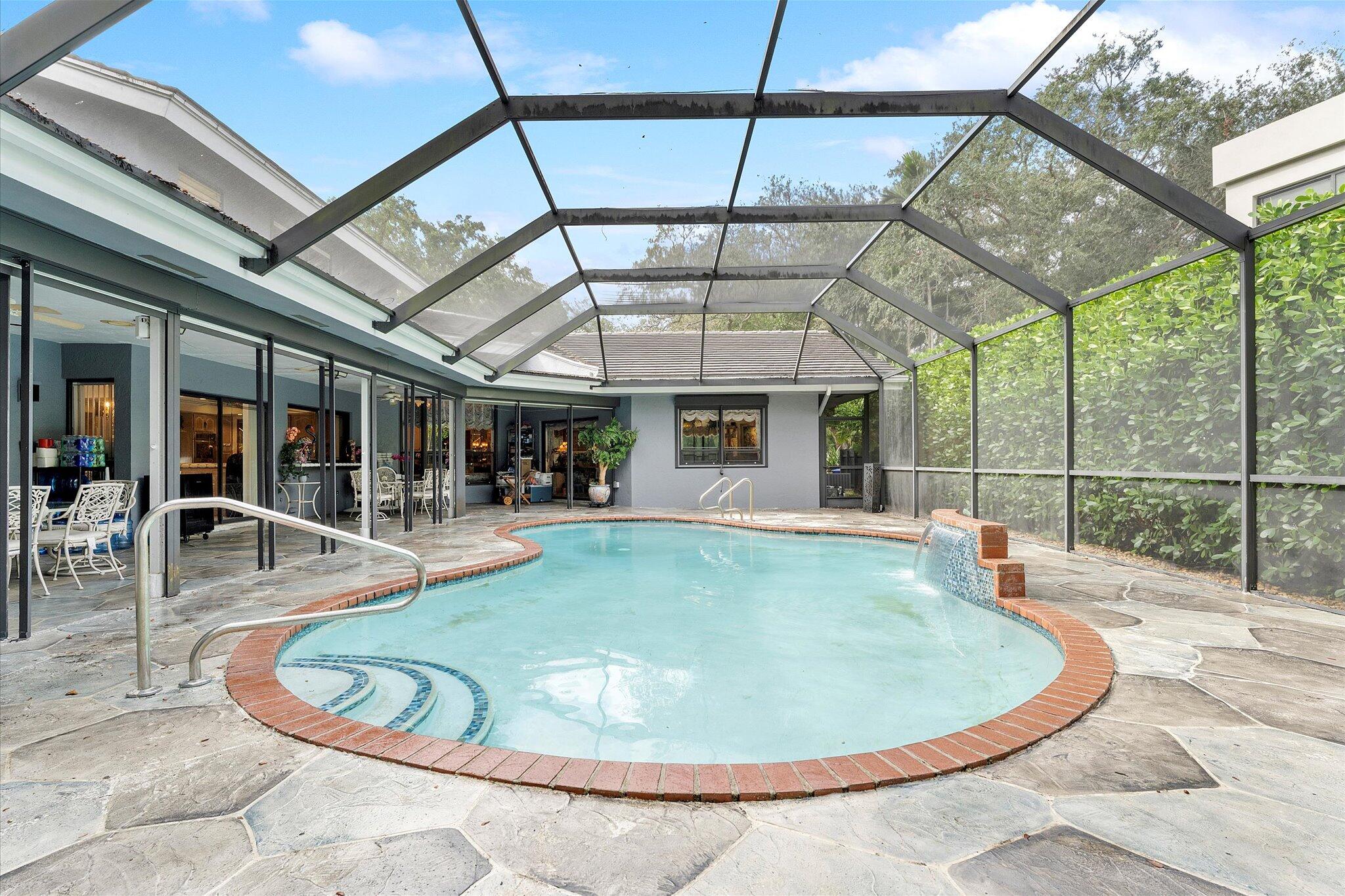 3333 Southwest 59th Street Fort Lauderdale, FL 33312 - Photo 52 of 56 a view of a swimming pool with a patio