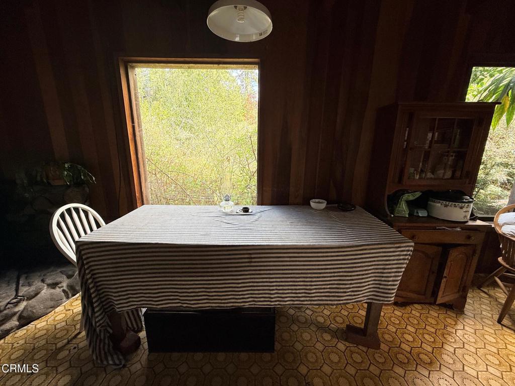 3480 Albion Ridge G Road South Albion, CA 95410 - Photo 11 of 32 a bedroom with a bed and a chandelier