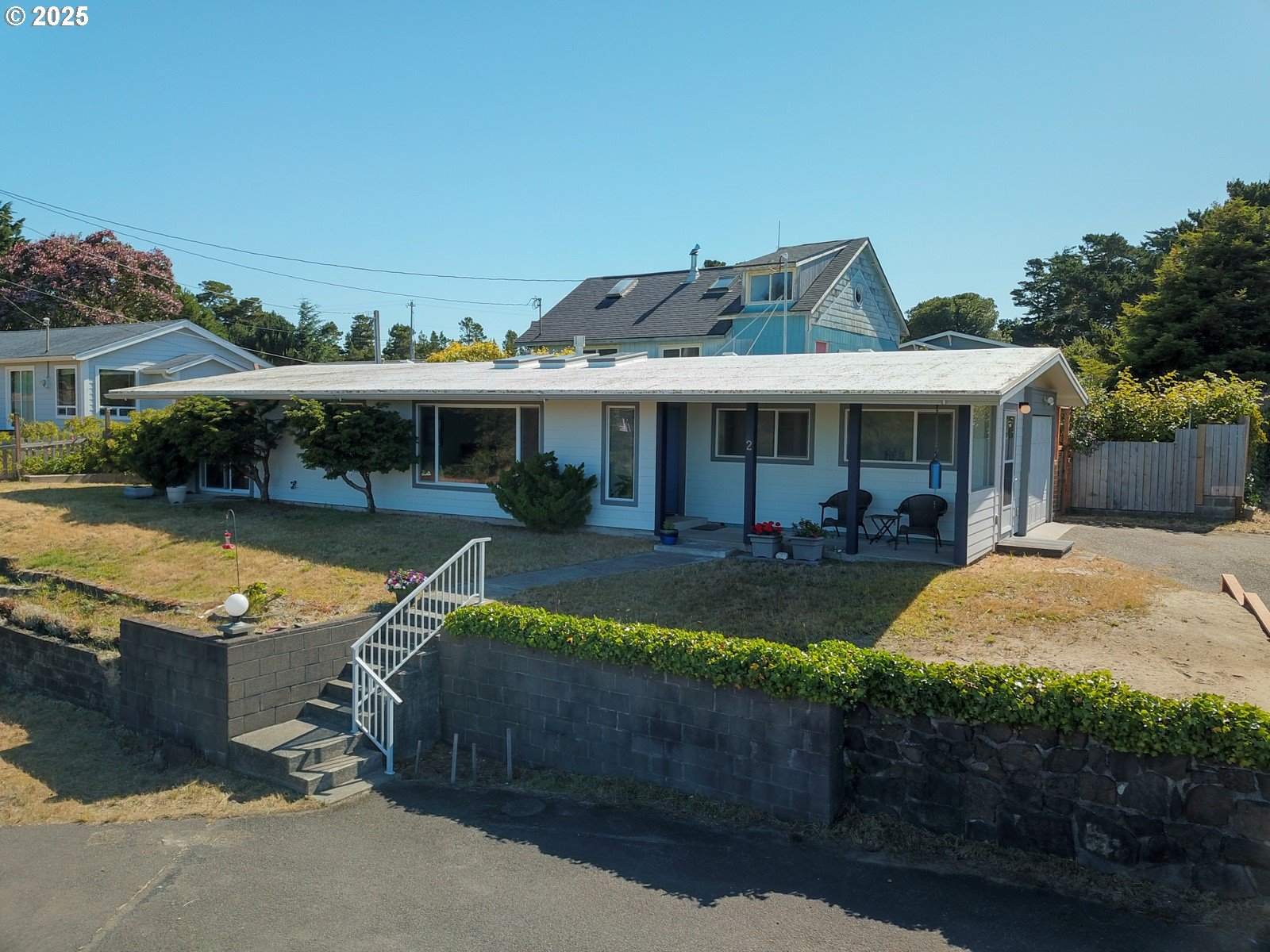 a view of a house with swimming pool and a yard