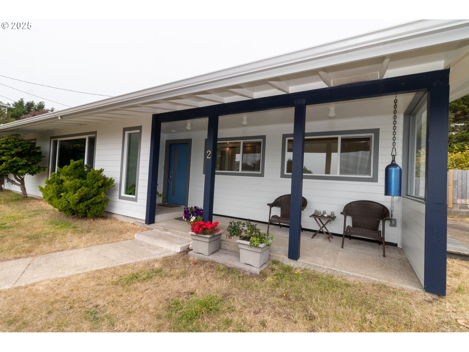 2 Eden Lane Florence, OR 97439 - Photo 15 of 48 a backyard of a house with barbeque oven table and chairs