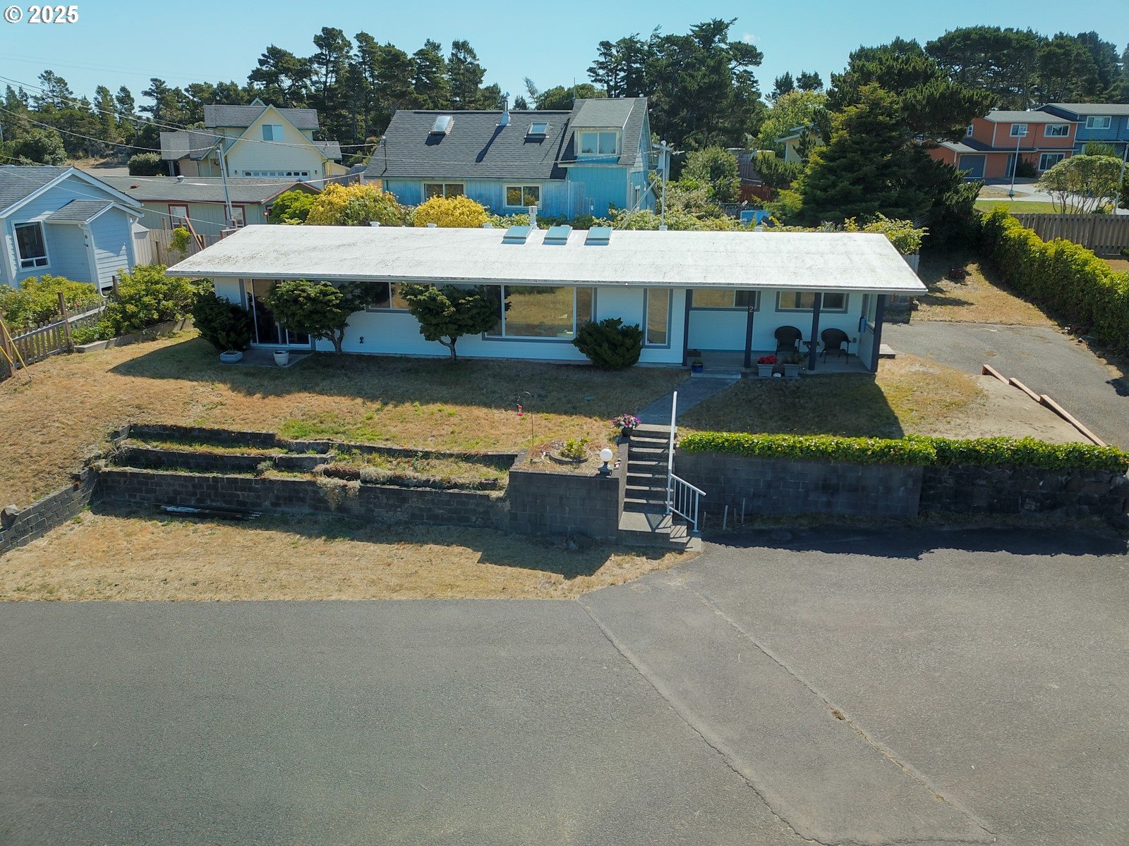 2 Eden Lane Florence, OR 97439 - Photo 2 of 48 an aerial view of a house with a garden and lake view