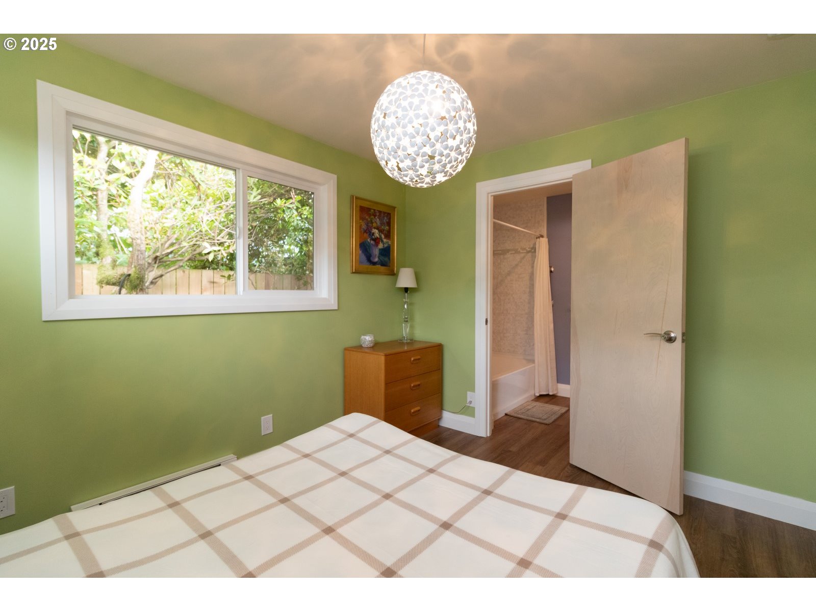 2 Eden Lane Florence, OR 97439 - Photo 34 of 48 a bedroom with a bed and a chandelier