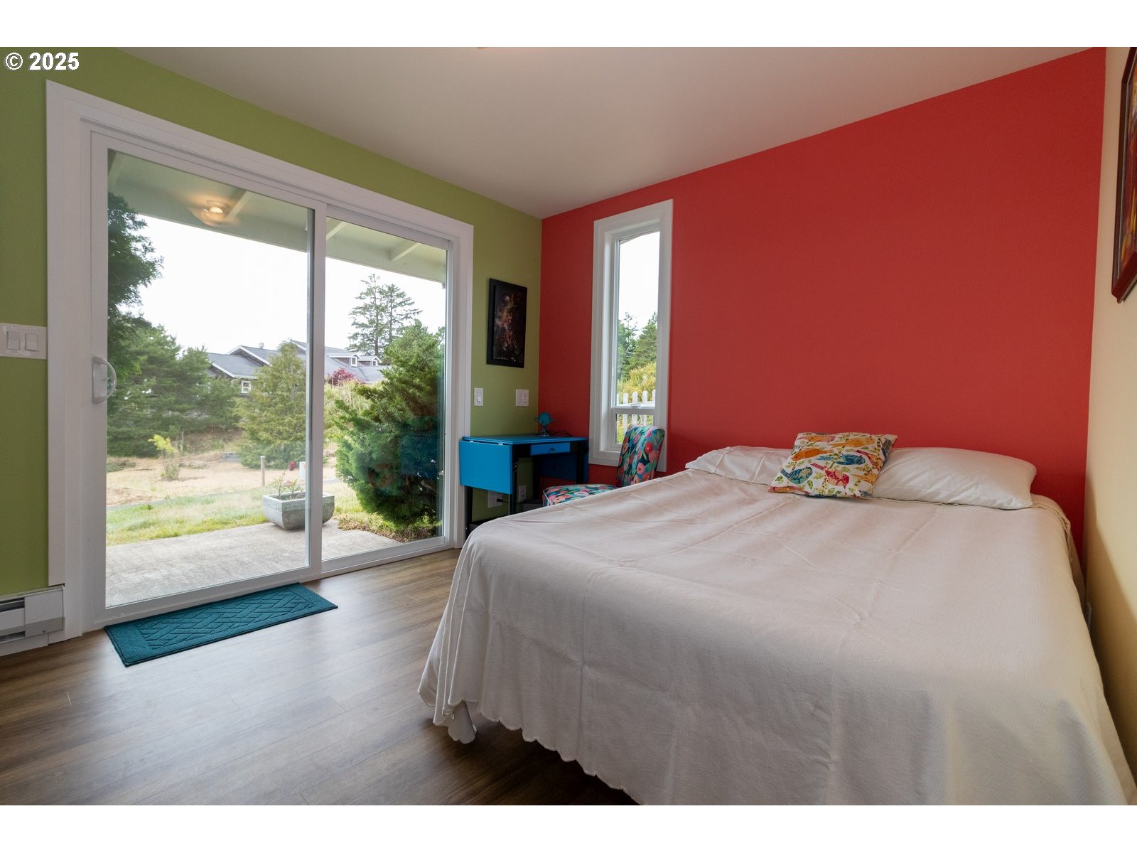 2 Eden Lane Florence, OR 97439 - Photo 37 of 48 a bedroom with a large bed and a large window