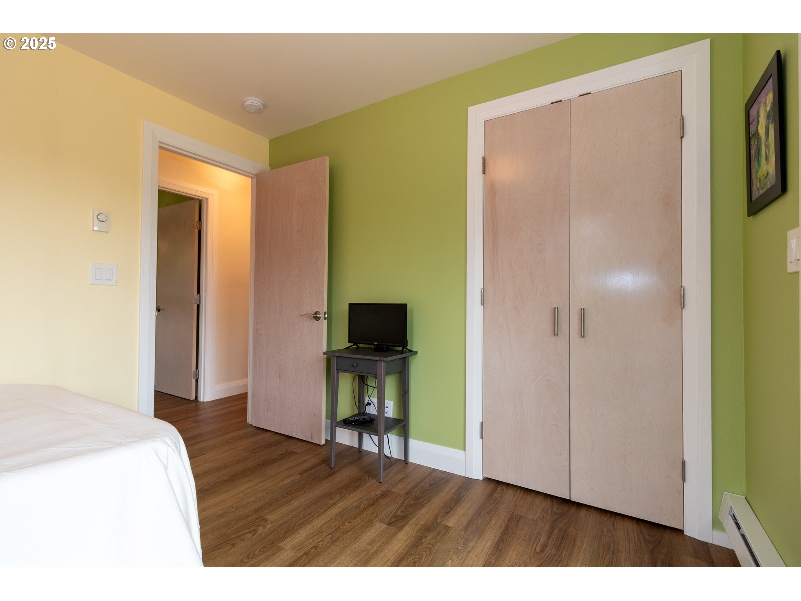 2 Eden Lane Florence, OR 97439 - Photo 38 of 48 a bedroom with a bed and a television in it