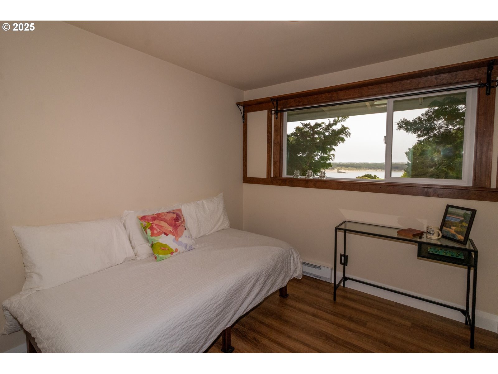 2 Eden Lane Florence, OR 97439 - Photo 41 of 48 a bedroom with a bed and wooden floor