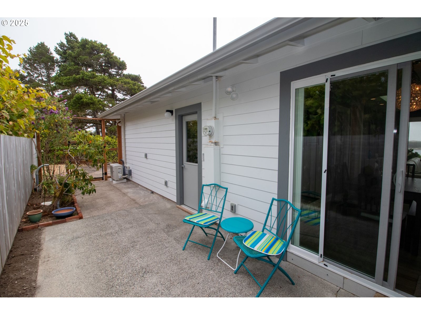 2 Eden Lane Florence, OR 97439 - Photo 42 of 48 a view of a chair and table in backyard of the house
