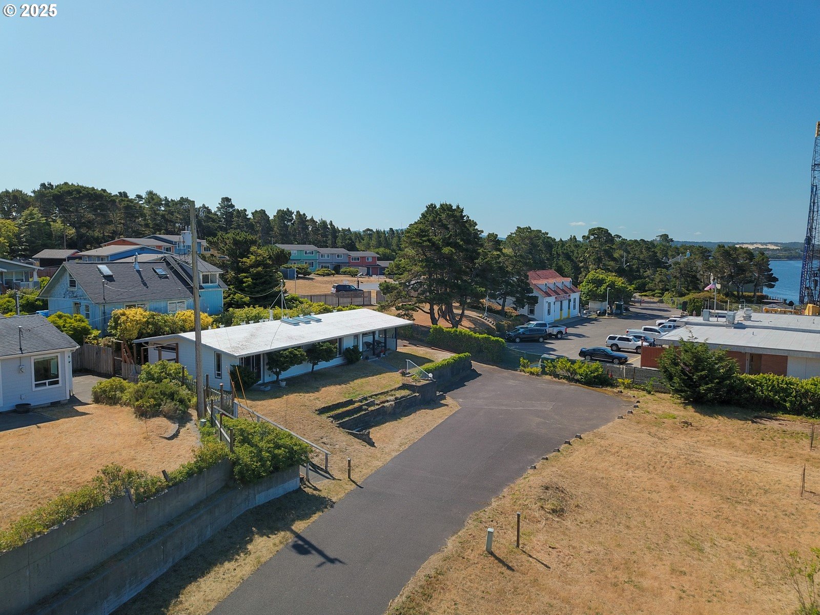 2 Eden Lane Florence, OR 97439 - Photo 44 of 48 a view of a lake with couches and city view