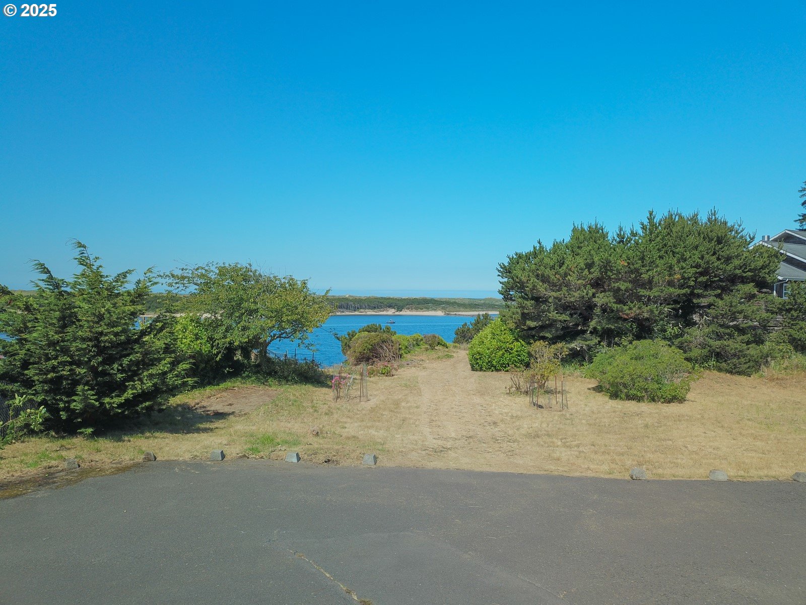 2 Eden Lane Florence, OR 97439 - Photo 46 of 48 a view of a road with a yard
