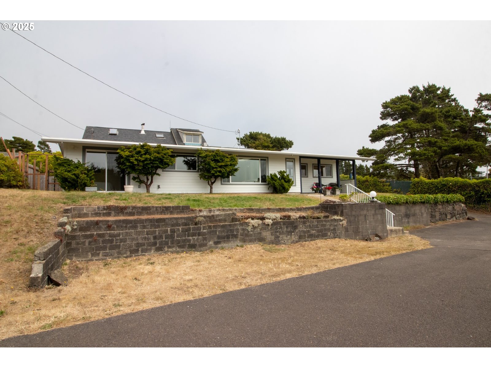 2 Eden Lane Florence, OR 97439 - Photo 6 of 48 a view of swimming pool with a yard and plants