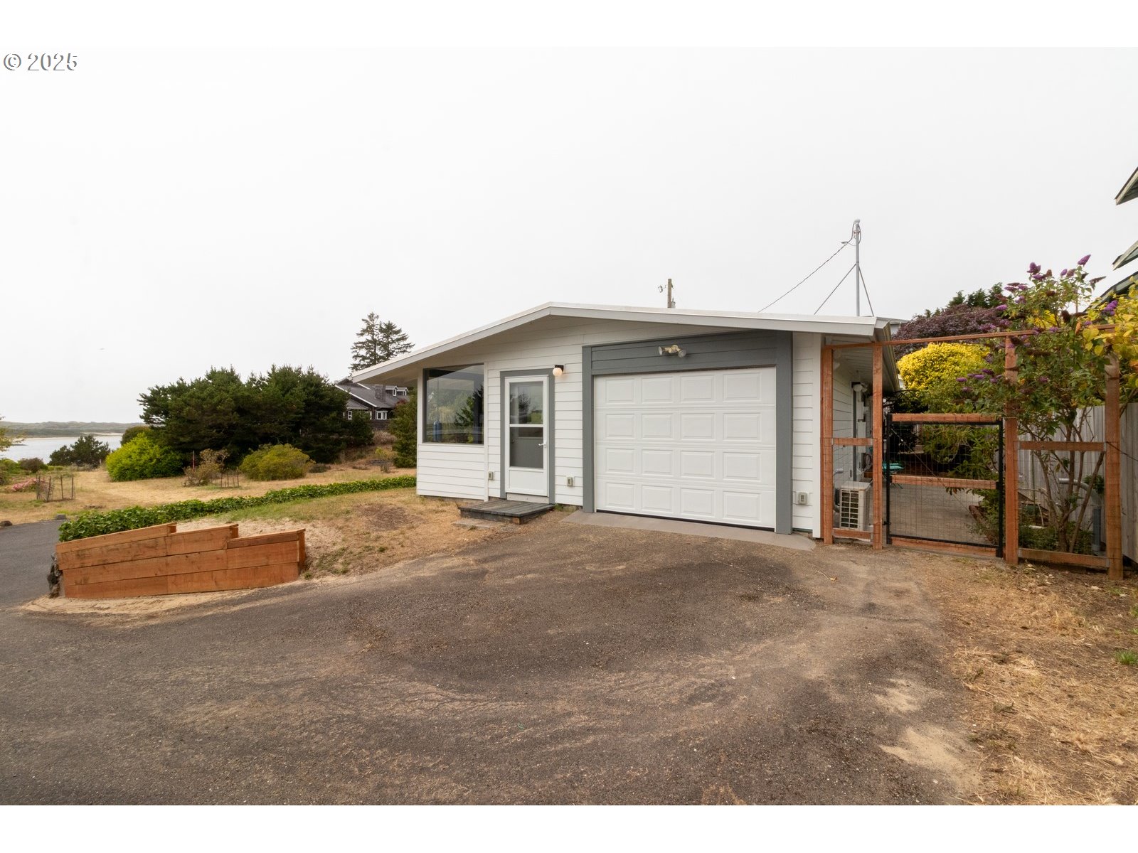 2 Eden Lane Florence, OR 97439 - Photo 9 of 48 a view of large house with a yard