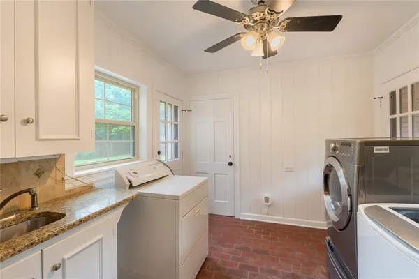 a kitchen with a refrigerator and a sink