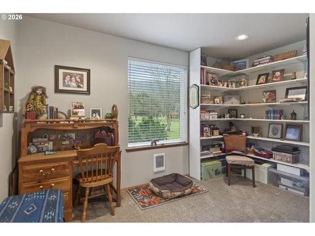 a workspace with furniture and a window