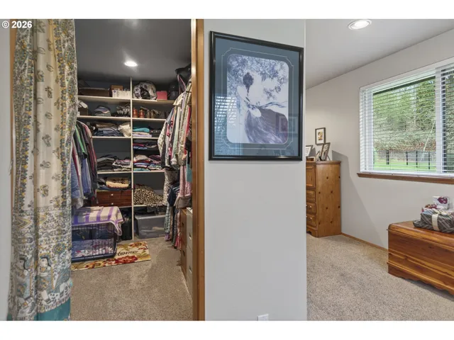 a view of a workspace with furniture and window