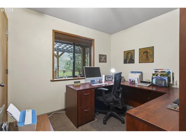 a workspace with furniture and window