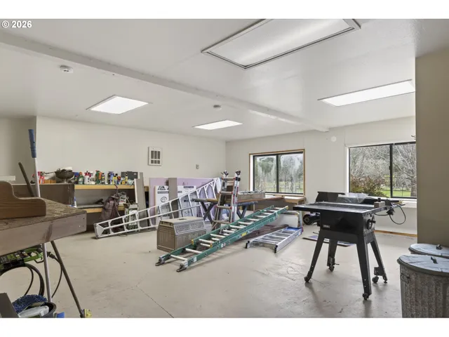 a room with gym equipment and a large window