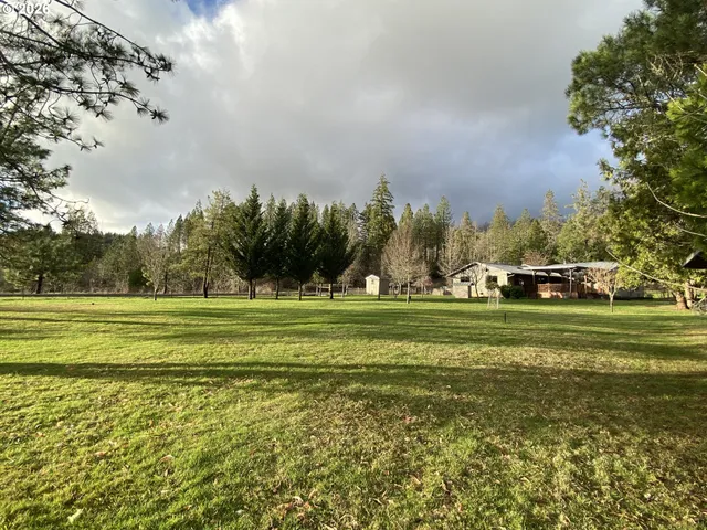 a view of a golf course with a lake