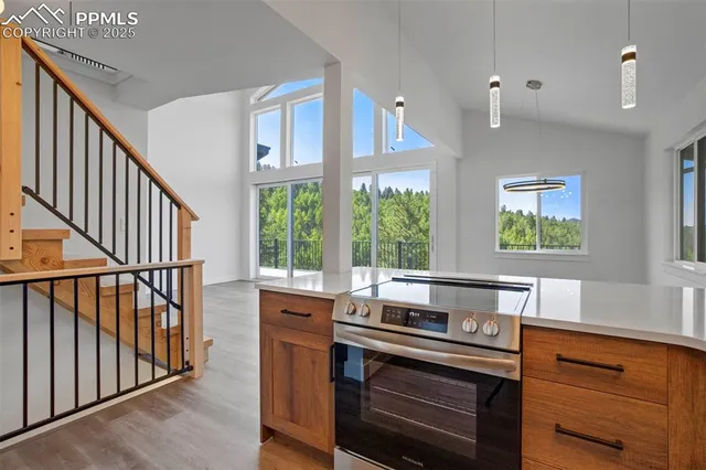 a kitchen with stainless steel appliances a stove and cabinets