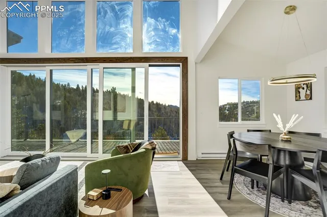 a view of a dining room with furniture window and outside view