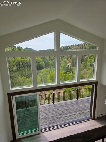 a view of balcony with wooden floor