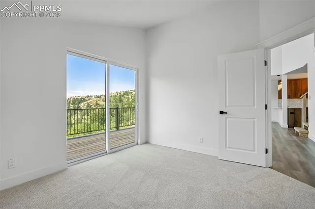 a view of an empty room with a tv
