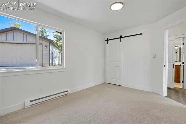 a view of an empty room with a window