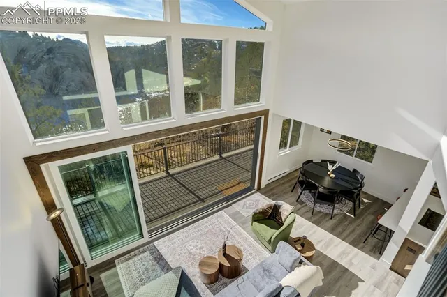 a bedroom with a bed and a couch next to a window