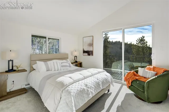 a bedroom with a bed and glass window