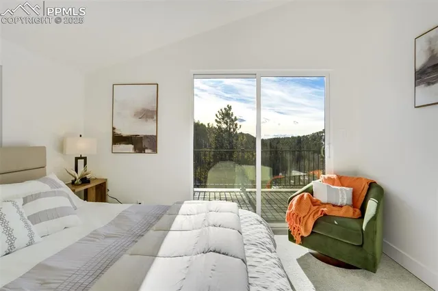 a bedroom with a bed and wall painting