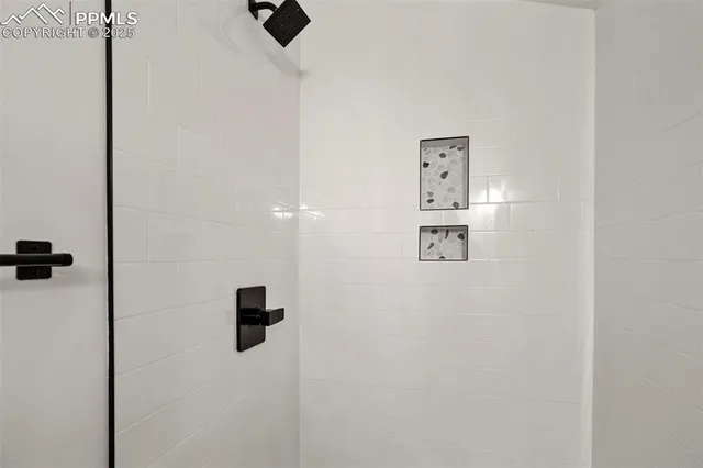 an entryway with wooden floor and windows