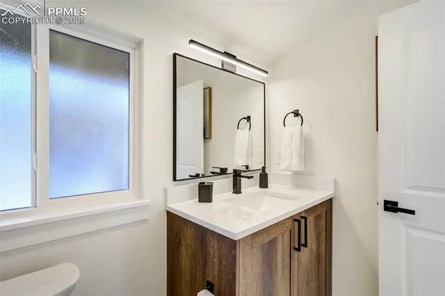 a bedroom with furniture and a book shelf