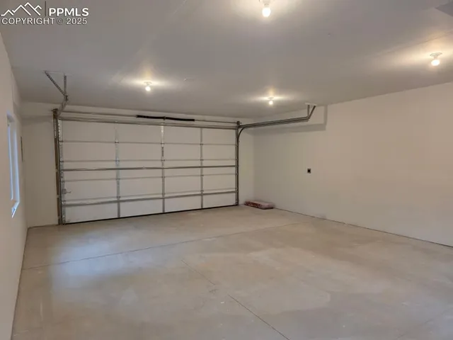a view of a back yard of the house with swimming pool