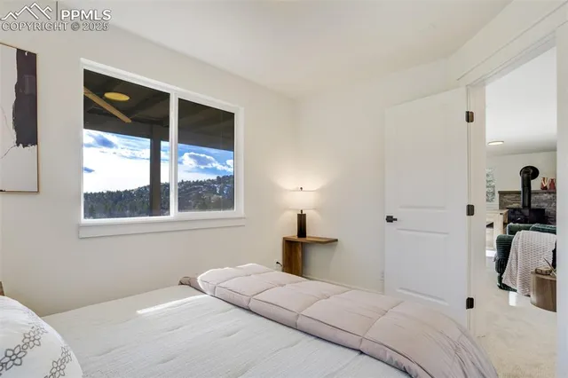 a bathroom with a granite countertop sink toilet mirror and shower