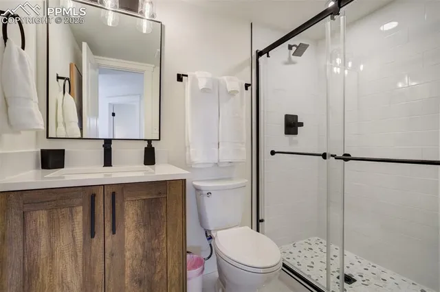 a view of balcony with wooden floor and fence