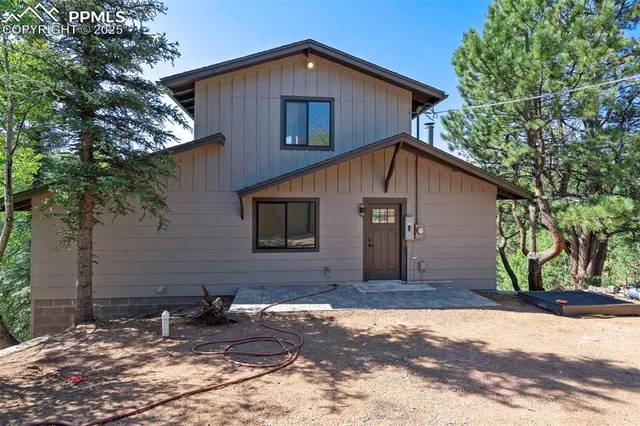 a house with a tree in front of it