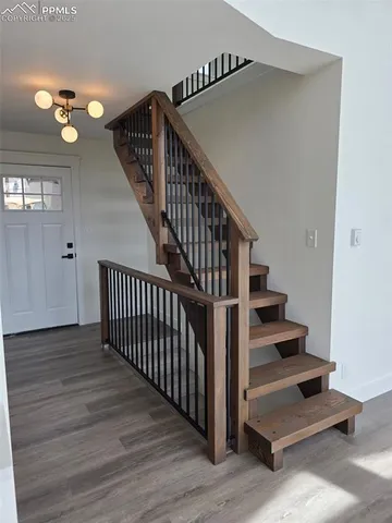 a view of entryway with wooden floor