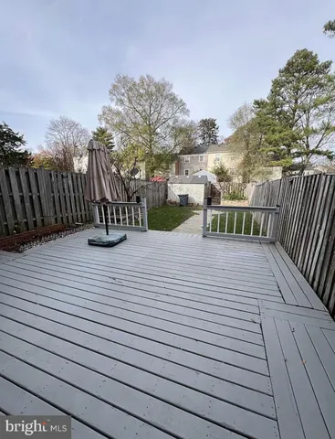 a view of a terrace with wooden fence