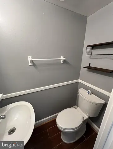 a bathroom with a toilet and a sink