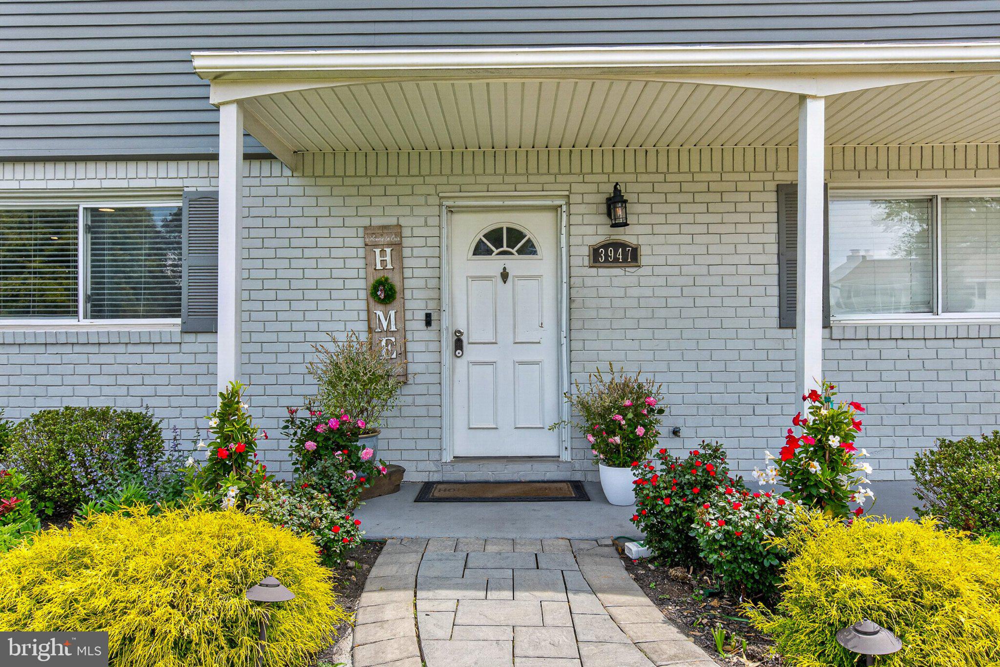 3947 Susanna Road Randallstown, MD 21133 - Photo 7 of 52 Charming entryway with vibrant blooms.