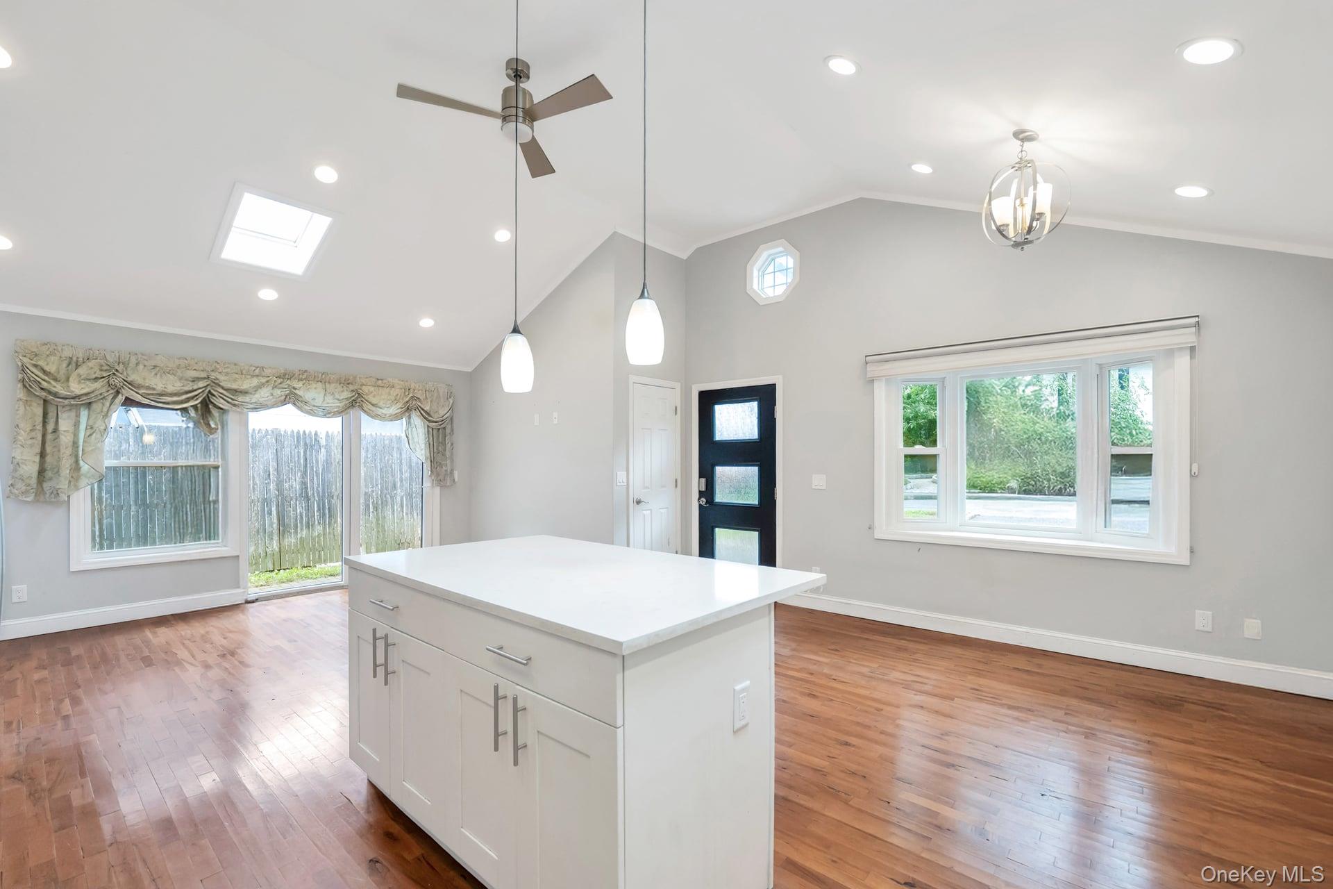 30 Harding Road Ronkonkoma, NY 11779 - Photo 13 of 38 a large kitchen with kitchen island a large island in it
